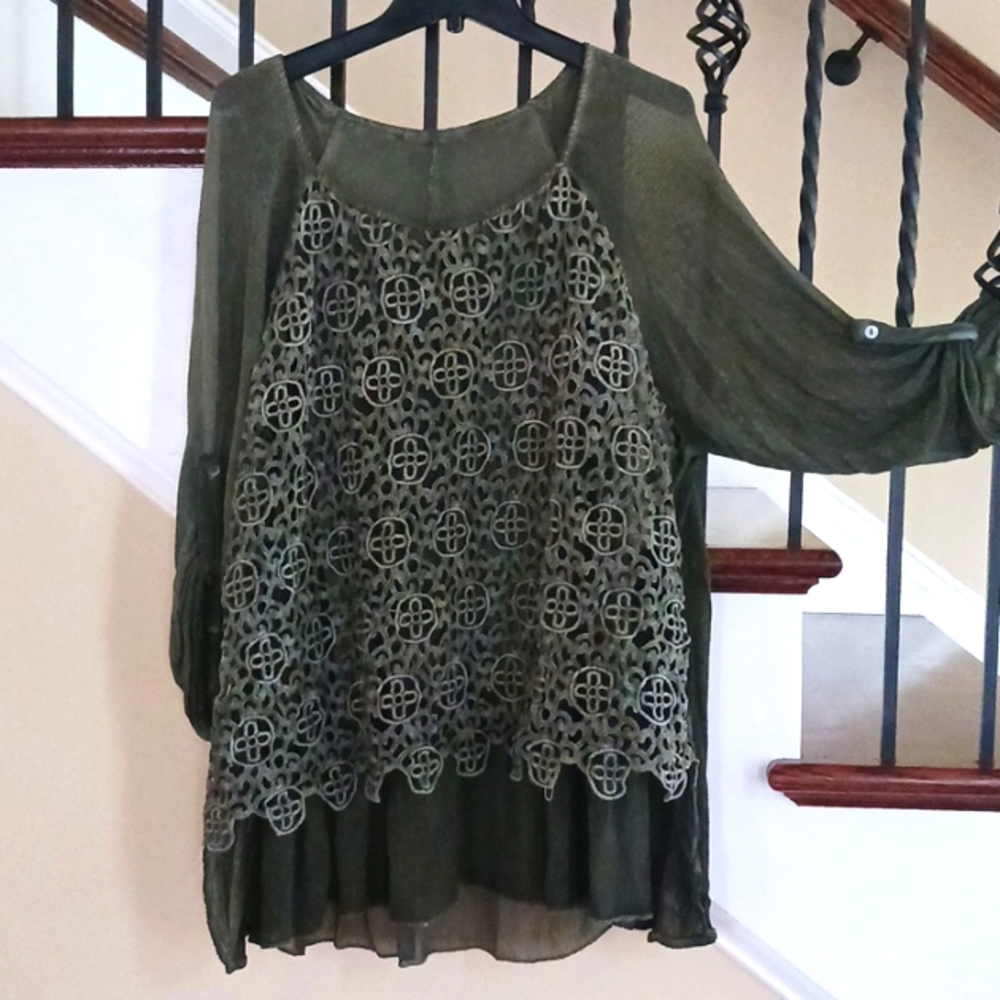 Made and bought in Italy.  Very beautiful top. Size L.